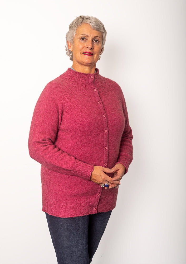 AOK Clothing delivers with this buttoned cardigan crafted with cable detailing. Expertly crafted from a blend of New Zealand possum fur and fine merino wool, this garment provides remarkable warmth, elegance and comfort.