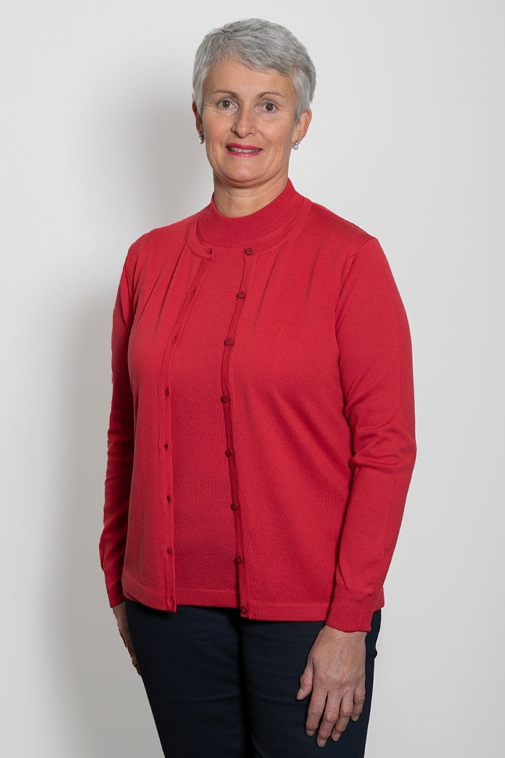 Raspberry, AOK Clothing's Classic Merino Button to Neck Cardigan is available in a variety of colours This fully fashioned button to neck style cardigan is constructed of 100% Fine NZ Merino Wool and made in Italy