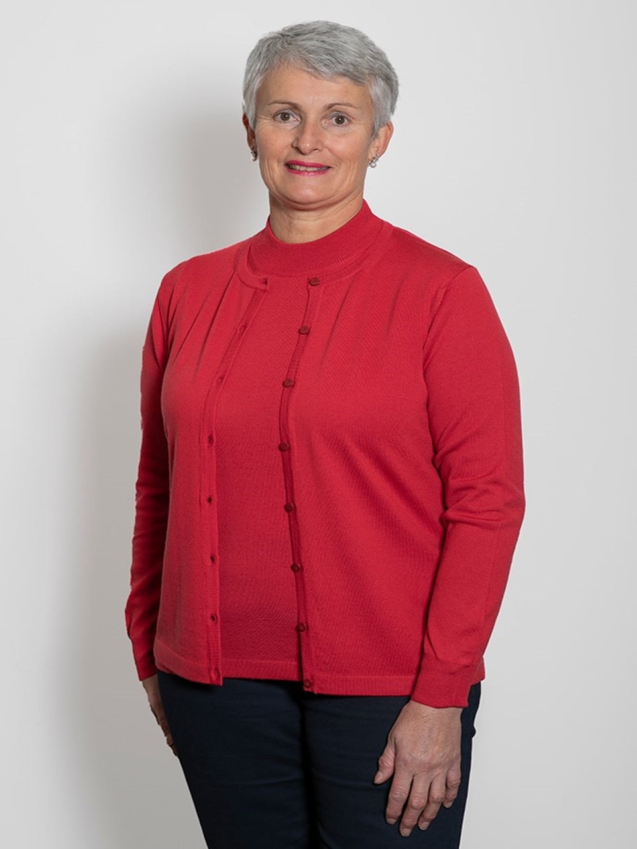 Raspberry, AOK Clothing's Classic Merino Button to Neck Cardigan is available in a variety of colours This fully fashioned button to neck style cardigan is constructed of 100% Fine NZ Merino Wool and made in Italy